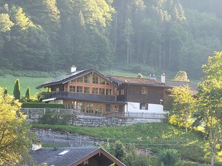 The spacious house is located above the village