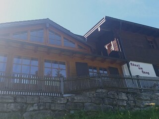 The glass front and the traditional part of the house