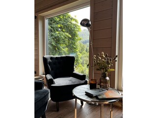 Comfortable armchair in front of the stove