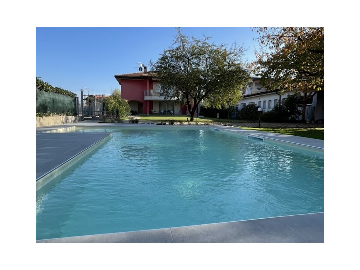 House exterior with garden and pool