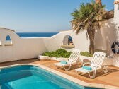 terrace with pool and direct sea view