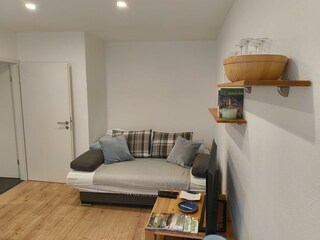 Wohnzimmer mit Schlafsofa
