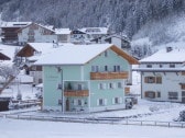 Apartments Latemar-unser Haus im Winter