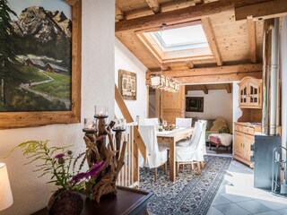 Living-bedroom with large dining table and fireplace