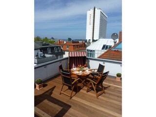 Roof terrace with beach basket chair