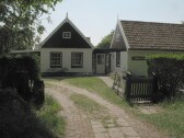 front view of the house in summer time