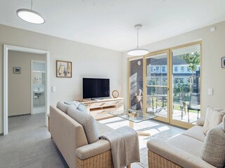 Integral Immobilien: Dein Darß Urlaub Born - Wohnbereich mit Terrasse der Ferienwohnung To Huus