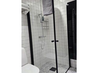 Bedroom 1, bathroom with a shower