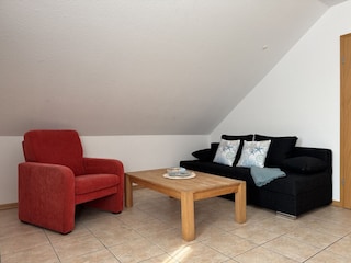 Wohnzimmer mit Schlafsofa