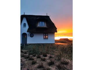 Das Haus mit Sonnenuntergang