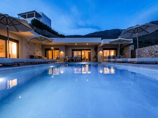 House and pool by night