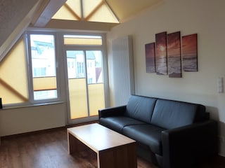 Sofa im Wohnzimmer der Ferienwohnung Sonneneck