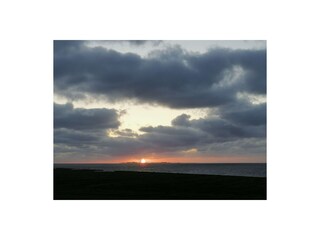 Sonnenuntergang mit Blick vom Balkon