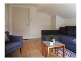 Wohnzimmer mit Schlafsofa