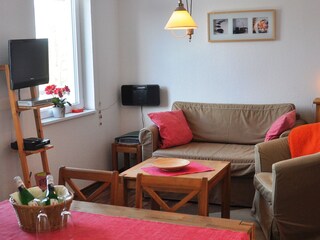 Wohnbereich mit ausziehbarer Couch