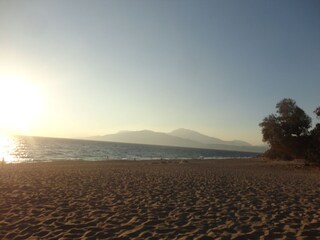 sunset in Komos beach