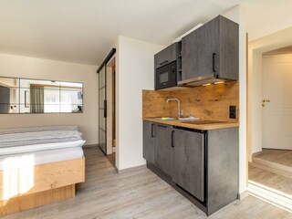 Appartement Top 3 Wollgras-Ku?chenzeile-Wohnraum