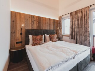 Schlafzimmer mit Balkon Hochkönigblick