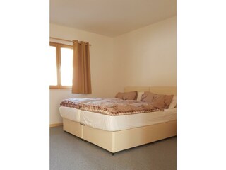 smaller downstairs bedroom from door
