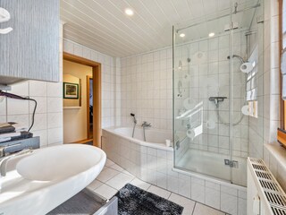 Bathroom with shower and bathtub