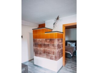 Wohnzimmer Kachelofen