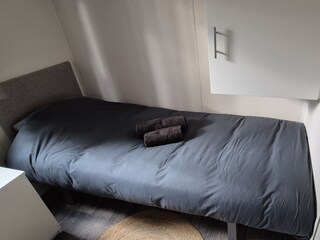 Spacious wardrobes provide ample storage.