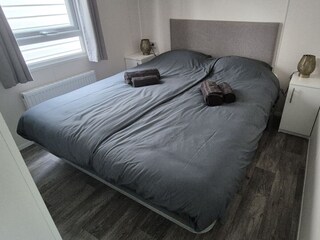 A peaceful retreat with a double bed, bedside tables.