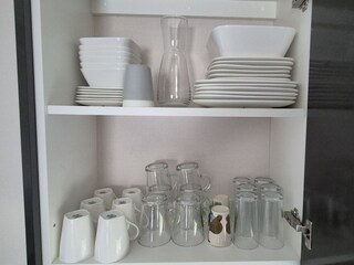 Plenty of tableware, and utensils.