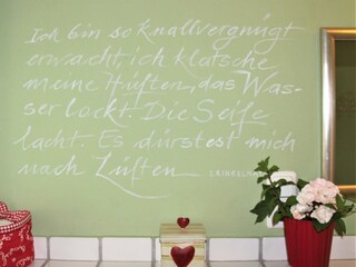 Spruch im Badezimmer "Garten Eden"