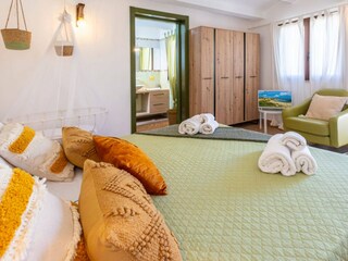 Family room with double and baby crib