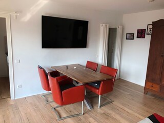 dining table , leather seats and TV