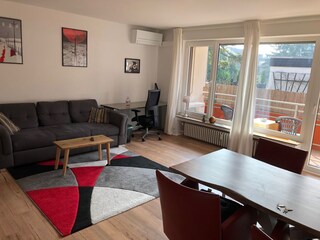 living room with office desk and Wifi router