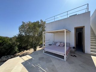 Veranda mit Zugang auf die Dachterasse und das Zimmer
