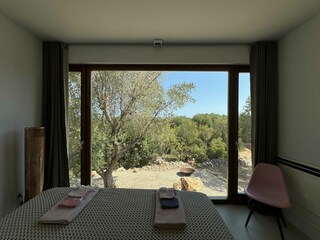 Bedroom with panoramic view of the greenery