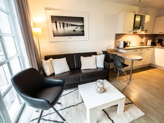 Gemütliche Sitzecke mit 55" Smart TV und Schlafsofa