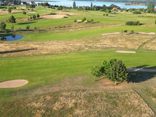 Balmer See golf course, with a view of the Achterwasser