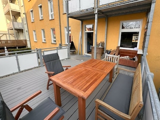 Terrace with barbecue and garden furniture