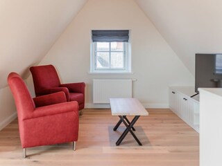 Im Dachgeschoss befinden sich ein Loungebereich...