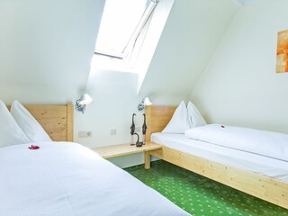 sleeping room with separate beds