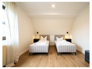 Schlafzimmer 3 im OG mit TV