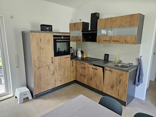 Ferienhaus offener Wohn- und Essbereich mit Küche