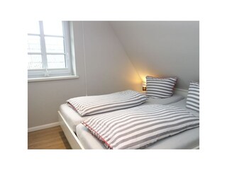 Ein zweites Schlafzimmer mit Doppelbett 180x200cm..
