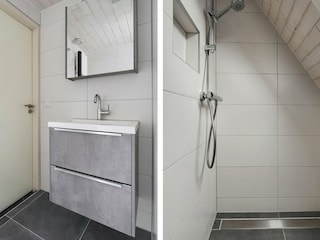 Badezimmer mit einer Dusche und einer Waschbecken.