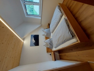 Schlafzimmer mit Bett