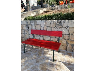 Red  bench on the sea terrace