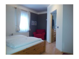 Ferienanlage Haus - Schlafzimmer mit Couchsessel