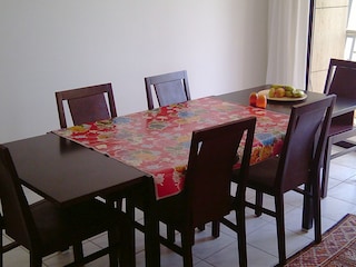 Dining table with six comfortable chairs