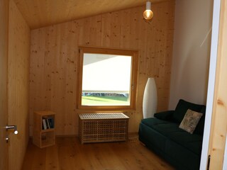 Zimmer zum Westen mit Bettsofa, Leseecke