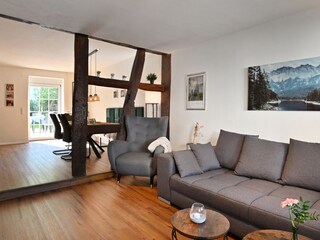 living area, dining area + exit to inner courtyard