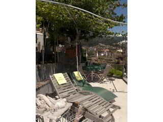 Sun lounges, barbecue and dining table